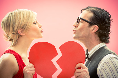 Nerd man boyfriend kiss his girlfriend love portrait with heart for valentine dayの写真素材