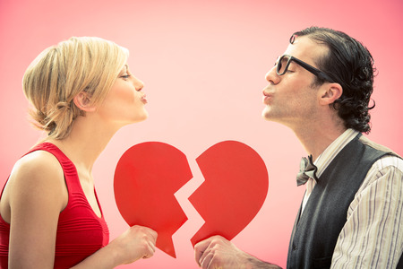 Nerd man boyfriend kiss his girlfriend love portrait with heart for valentine dayの写真素材