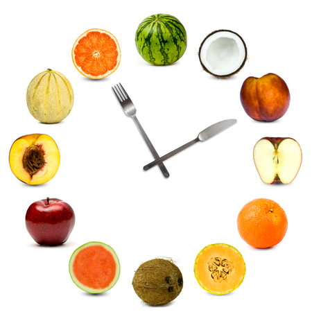 clock made of different fruit composition set isolated on whiteの写真素材