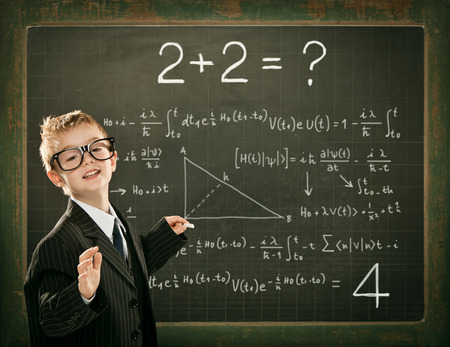 young clever scientist children students write on  blackboard