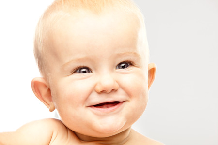 beautiful blonde hair blue eyes baby isolated on whiteの写真素材