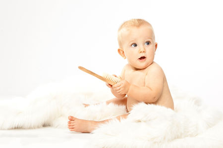 beautiful blonde hair blue eyes baby isolated on whiteの写真素材