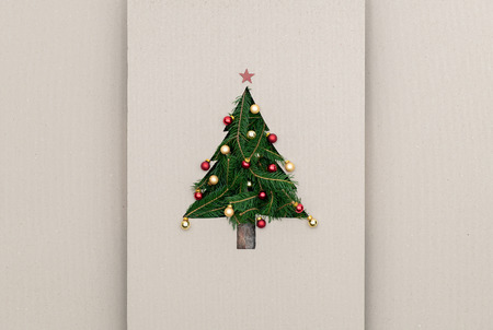 Text or empty copy space in vertical top view cardboard with natural eco decorated christmas tree pine.Xmas winter holiday season party social media card backgroundの写真素材