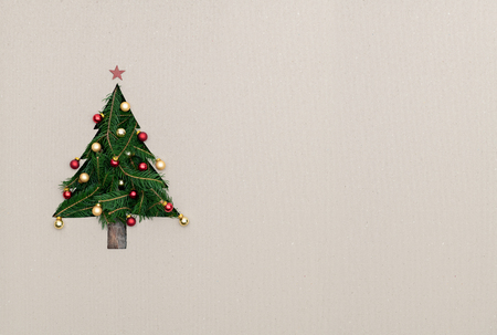 Text or empty copy space in vertical top view cardboard with natural eco decorated christmas tree pine.Xmas winter holiday season party social media card backgroundの写真素材