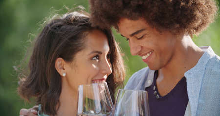 Romantic young woman and man tasting wine having exciting private degustation at italian vineyard winery. Winetasting culture. Wine tasting.Red wine tasting people enjoy drinking. close upの写真素材