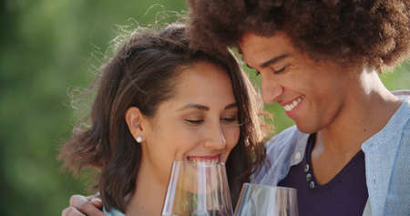 Romantic young woman and man tasting wine having exciting private degustation at italian vineyard winery. Winetasting culture. Wine tasting.Red wine tasting people enjoy drinking. close upの写真素材