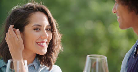 Romantic young woman and man tasting wine having exciting private degustation at italian vineyard winery. Winetasting culture. Wine tasting.Red wine tasting people enjoy drinking. close upの写真素材