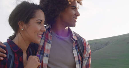 man and woman smiling and laughing together outdoor at sunset.Slow motion close-up.L oving couple...