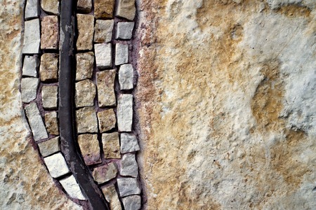 Mosaic on the left side of the stone wallの写真素材