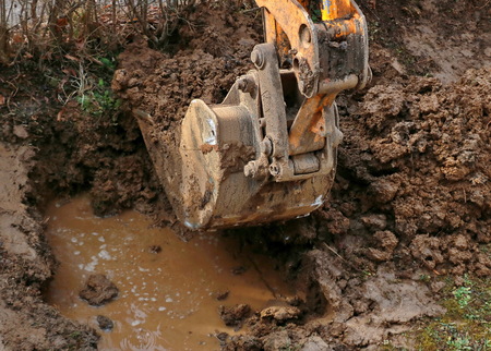 Rehabilitation of bursting water pipes with excavatorの写真素材