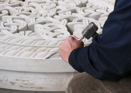 Manual processing of stone rosetteの写真素材