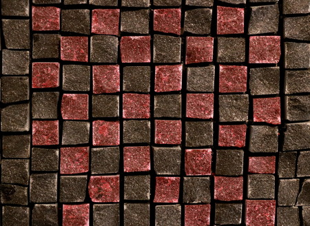 Part of the mosaic with dark red and brown tiles