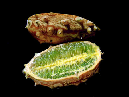 Sliced fruit Kivano (Kiwano) melon on black backgroundの写真素材