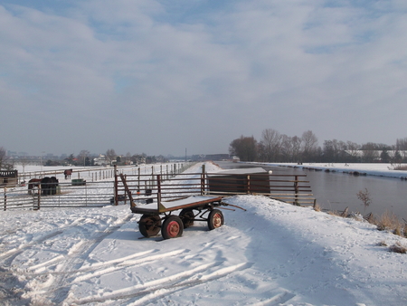 Snow on the meadows in the winter in Nieuwerkerk aan den IJssel in the Netherlands.の写真素材
