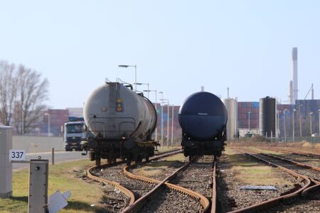 Vessel wagon waiting on rails on the track at the port of Rotterdam in the Heijplaat Harbourのeditorial素材