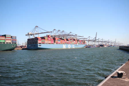 MOL container ship unloading containers at the Maasvlakte harbor in the Port of Rotterdam