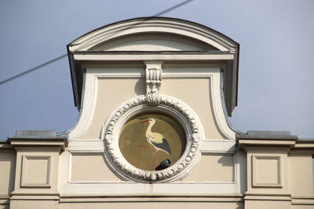 Old logo with a stork of the municipality of The Hague at the old city hall in the Javastraatのeditorial素材
