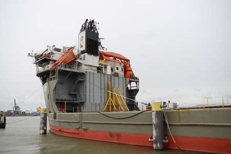 Semi-Submersible Barge Heavy Lift Vessel Fjord at a quay in the Waalhaven Harbor in the Port of...