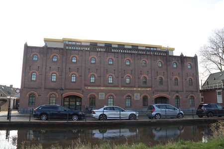 Bridges and buildings along the ring canal of the Zuidplaspolder in NIeuwerkerk aan den IJssel in the Netherlandsのeditorial素材