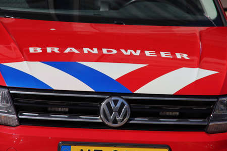Fire brigade vehicles of staff officers parked before head office of the Security area Rotterdam...