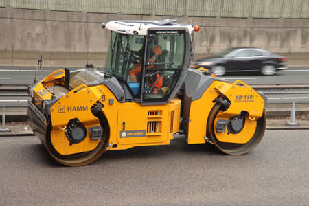 roller to flatten the asphalt during the reconstruction of the A20 motorway at Nieuwerkerk aan den...
