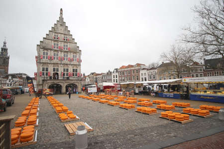 start of the touristic cheese market with children and old farmers and cheesemakers to demontrate cheese selling from the past