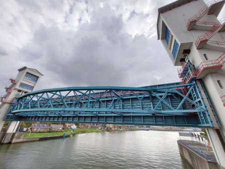 Two huge water barriers at Krimpen aan den IJssel as Hollandsche IJsselkering in the river Hollandsche IJssel with sluice to protect part of Holland agains Floodingのeditorial素材