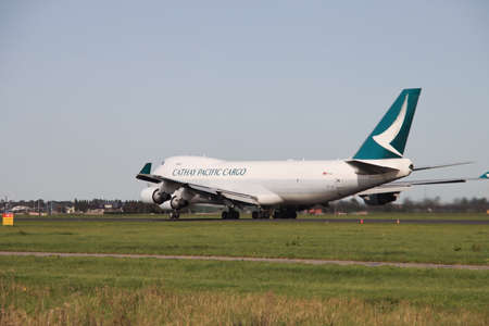 B-LIE Cathay Pacific Cargo type Boeing 747 400F is departing from the Polderbaan at Amsterdam Schiphol Airport in Netherlandsのeditorial素材