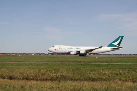 B-LIE Cathay Pacific Cargo type Boeing 747 400F is departing from the Polderbaan at Amsterdam Schiphol Airport in Netherlandsのeditorial素材
