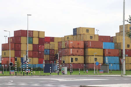 Sea containers stacked high for storage in the Waalhaven in the port of Rotterdam in the Netherlands