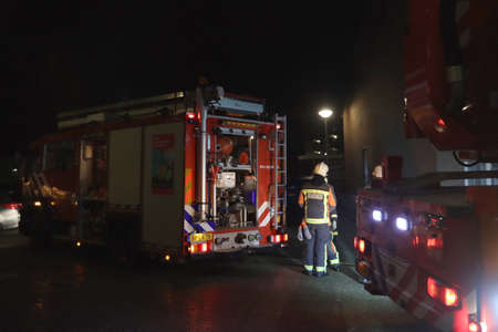 Fire department of Nieuwerkerk aan den IJssel busy fighting a fire in the evenings