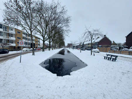 Snow on the streets and frozen water during the winter of 2021 in Nieuwerkerk aan den IJssel in the Netherlandsのeditorial素材