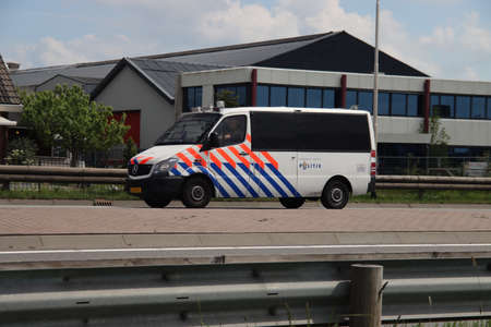 Cars of special riot forces of the Dutch police on the streets in Nieuwerkerk in the Netherlandsのeditorial素材
