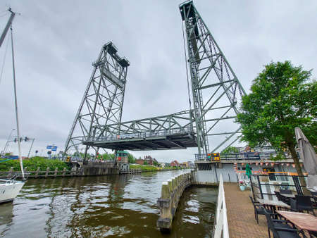 Steel lift bridge over the Gouwe at Waddinxveen open for high-masted ships in the Netherlandsの写真素材