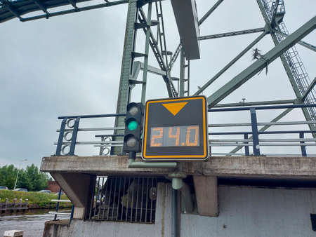 Steel lift bridge over the Gouwe at Waddinxveen open for high-masted ships in the Netherlands