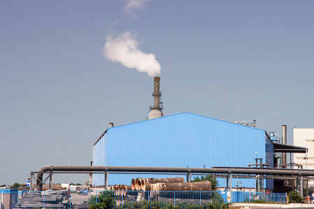 Smoke from the chimney at the Rotterdam Asphalt plant in the Pernis harborのeditorial素材