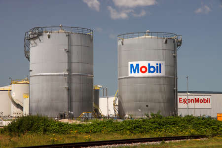 Oil storage tanks at the Exxonmobil terminal in the Pernis harbor in the Netherlandsのeditorial素材