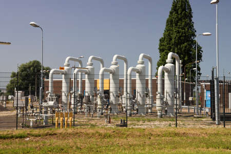 Cages with valves and control equipment for underground oil pipes in the port of Rotterdam in the Netherlandsのeditorial素材