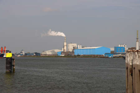Vapor from the chimney of the Rotterdam Asfalt Centrale in the Botlek harbor in the Netherlandsのeditorial素材