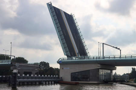Ameliabrug bridge over Gouwe at the N451 road opened for ship in Waddinxveen the Netherlandsのeditorial素材