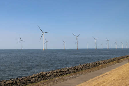 Modern wind turbines in the Noordoostpolder in the Netherlands for sustainable electricity