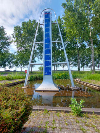 Statue in Nieuwerkerk aan den IJssel for lowest point of the Netherlands 6.74 m (21ft) below sealevel. This is in the Zuidplaspolder where new village will be build for 8.000 houses and 2 industrial zones in the Netherlandsのeditorial素材