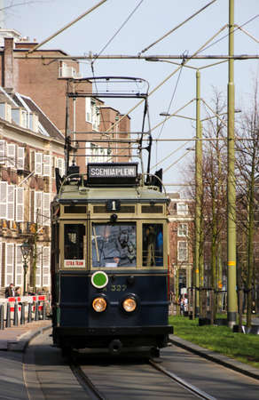blue historical streetcar driving at the Lange pondberg in The Hague as museum.のeditorial素材