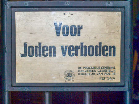 Sign with dutch text "For Jews forbidden" which means forbidden for jews from World War 2 in the Netherlandsのeditorial素材