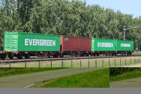 Traxx locomotive with container freight train on track close to Dordrecht in the Netherlands