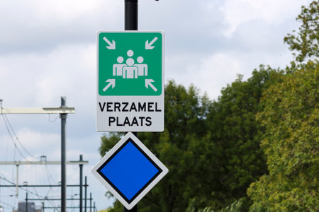 sign on end of platform Meeting point in case of emergency on Lansingerland station Zoetermeer the Netherlandsのeditorial素材