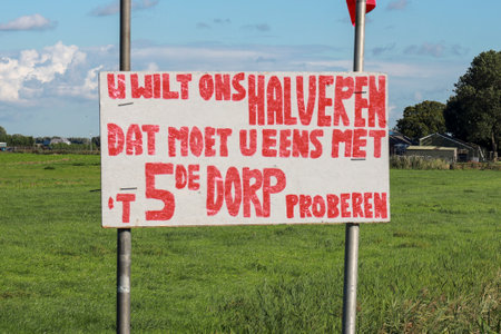 Protest sign farmers protest in Zevenhuizen along the N219 with request halving new fifth village in Zuidplas the Netherlandsのeditorial素材