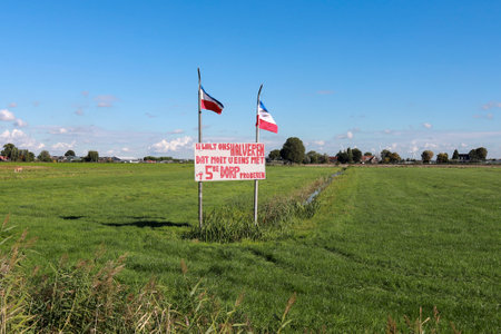 Protest sign farmers protest in Zevenhuizen along the N219 with request halving new fifth village in Zuidplas the Netherlandsのeditorial素材