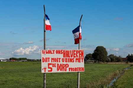 Protest sign farmers protest in Zevenhuizen along the N219 with request halving new fifth village in Zuidplas the Netherlandsのeditorial素材