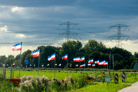 Protest signs and rows of flags upside down in Lekkerkerk along the N210 in the municipality of Krimpenerwaard the Netherlandsのeditorial素材